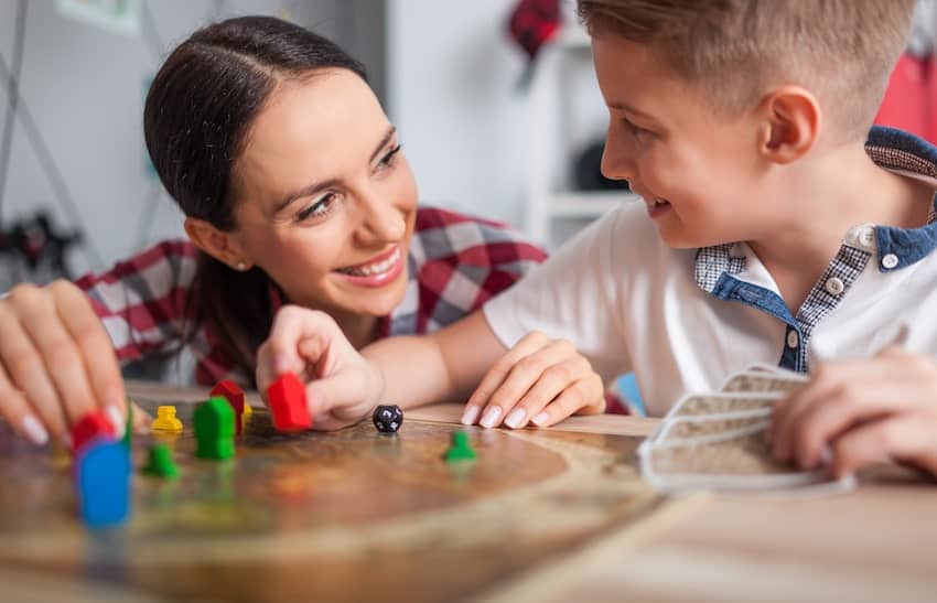 nanny playing with male child