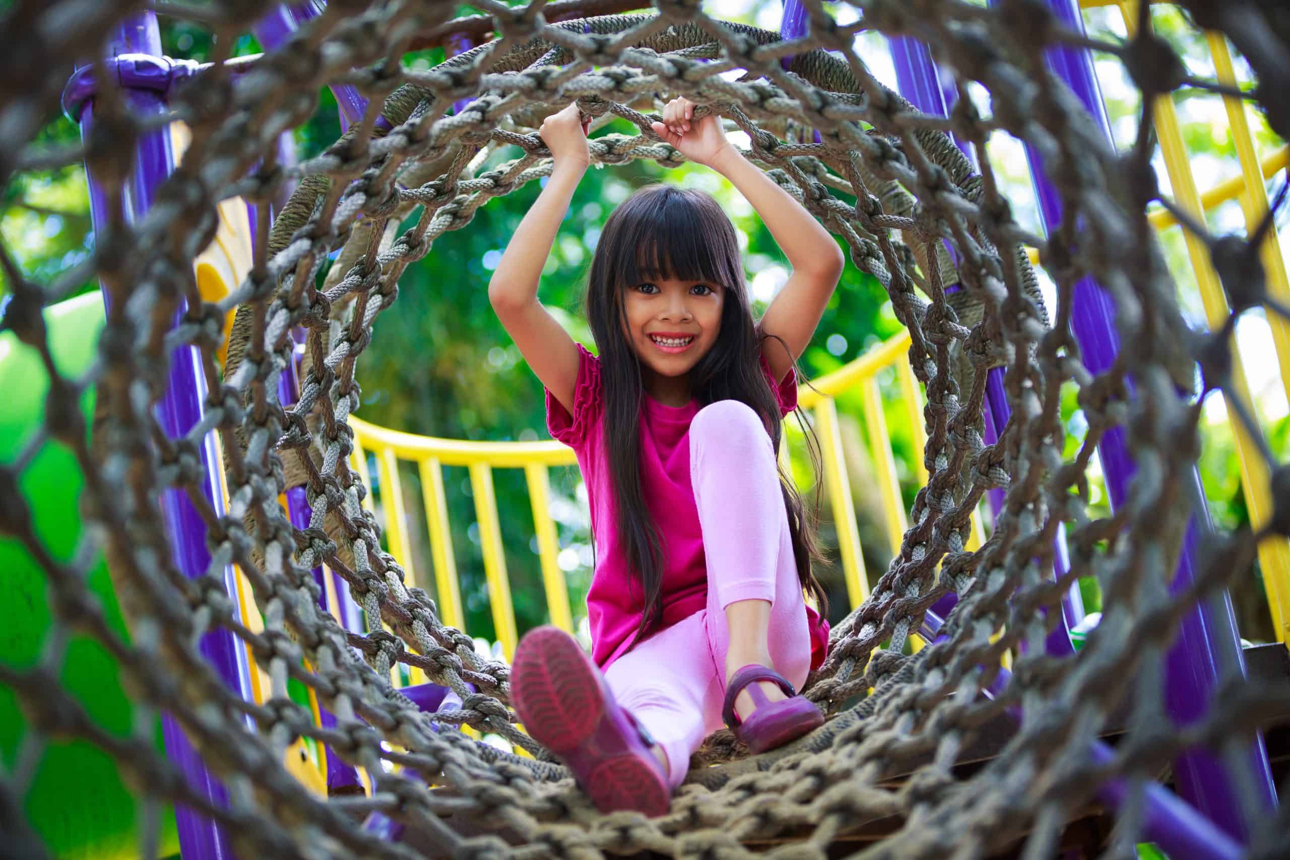 Asian girl enjoys playing at the playground – job Asian girl enjoys playing at the playground