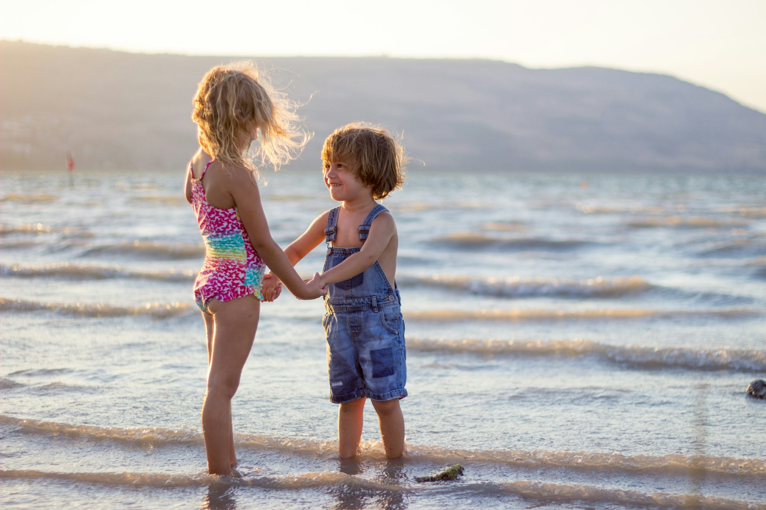 limor-zellermayer-COzpvQtcqMA-unsplash Girl and boy at the beach