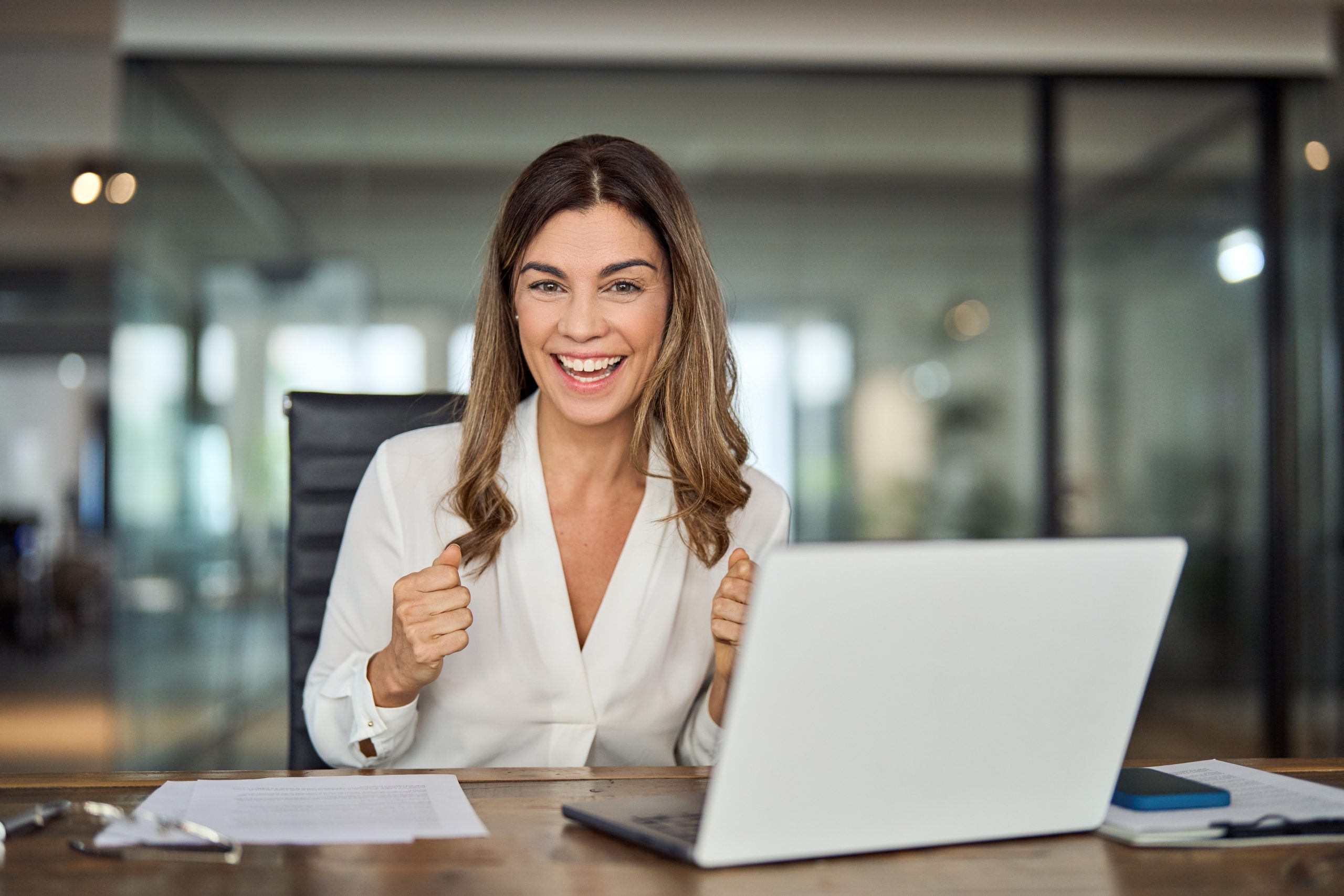 Happy,Excited,Mid,Aged,Mature,Professional,Business,Woman,Executive,Celebrating Happy Family Assistant at a desk