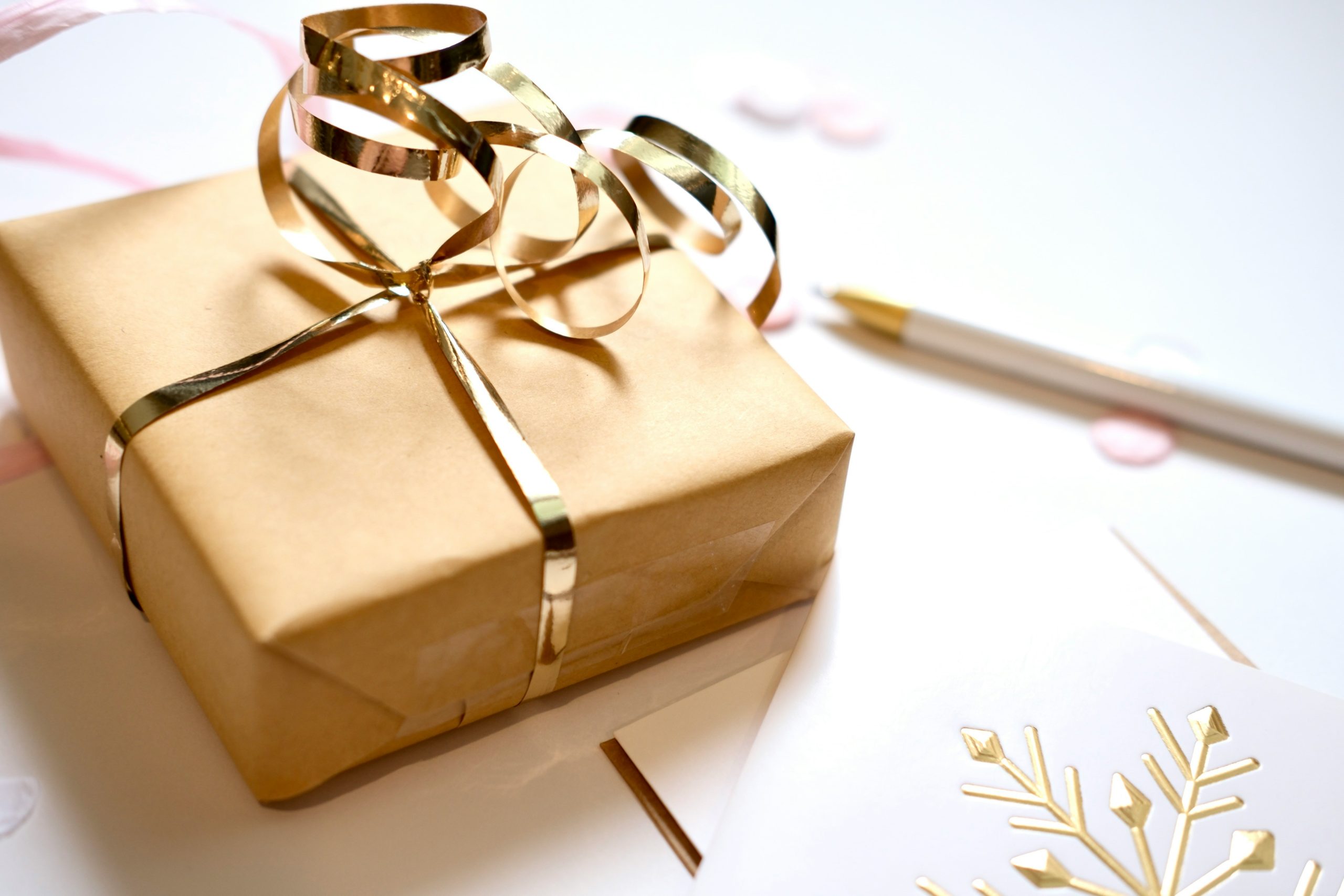 Beautiful gold wrapped gift with a gold ribbon